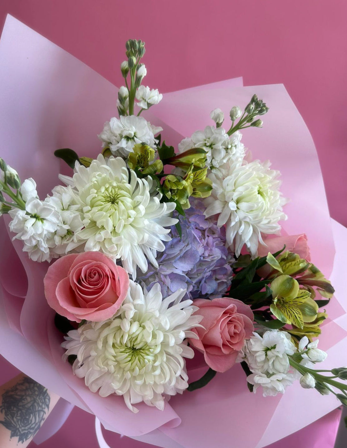 Elegant bouquet featuring vibrant roses, lush hydrangeas, delicate alstroemeria, and cheerful chrysanthemums – perfect for brightening someone's day 'just because