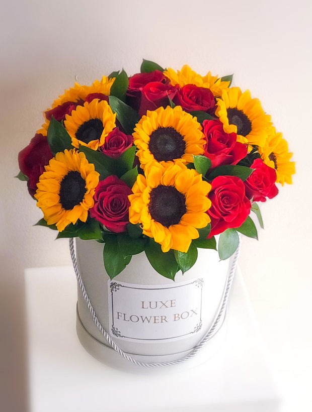Sun-Kissed Radiance Sunflowers and Red Roses in Hat Box