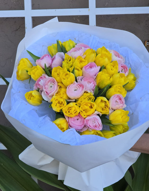 Elegant bouquet of Peony Double Tulips and Cloni Pink Ranunculus with lush petals, creating a soft and romantic floral arrangement.