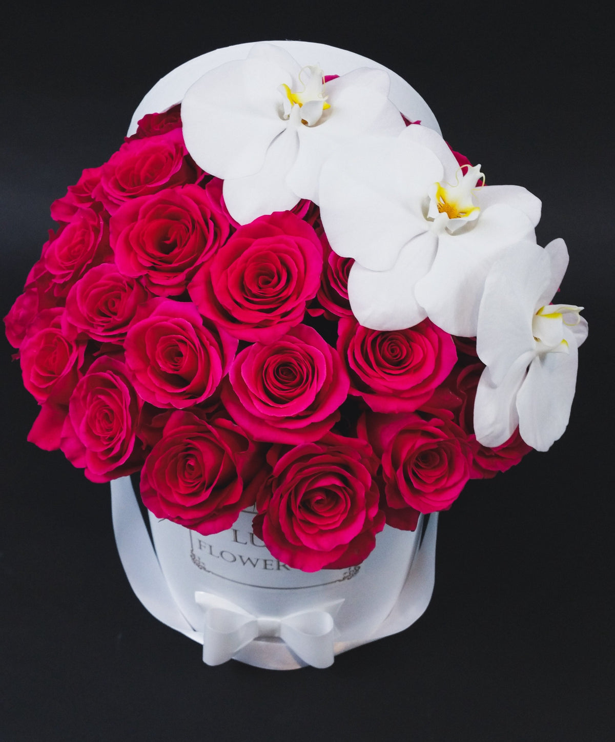 Valentine's Day "Orchid Elegance Roses" Roses in a box with 3 Blooms of Orchids
