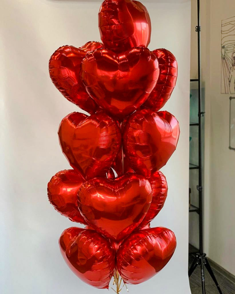 A colorful arrangement of balloons in various shapes and sizes, floating together to create a cheerful and festive display, perfect for celebrations or special occasions.