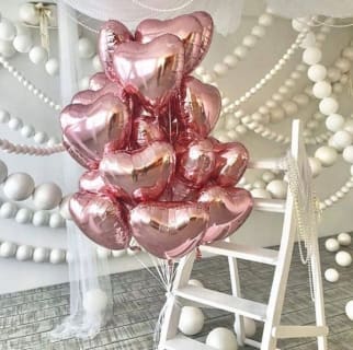 A colorful arrangement of balloons in various shapes and sizes, floating together to create a cheerful and festive display, perfect for celebrations or special occasions.